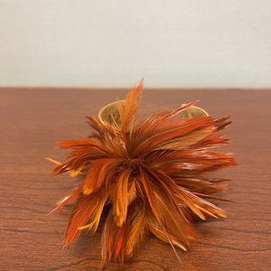 Funky Tasha orange cuff statement bracelet with orange feathers